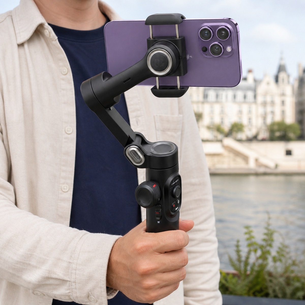 Creator holding a three-axis phone gimbal while filming outdoors